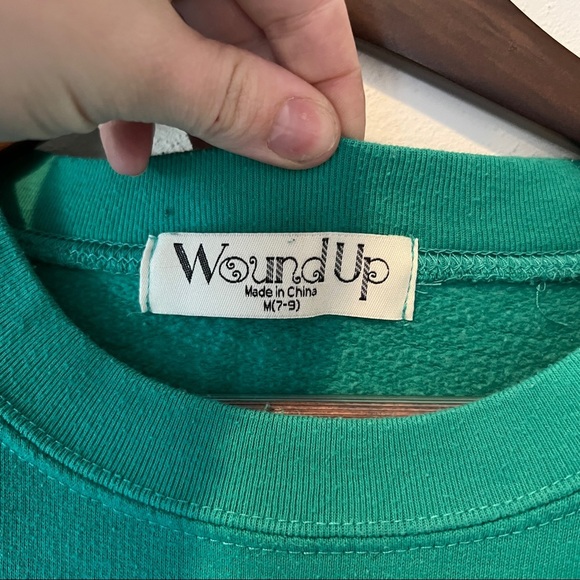 Wound Up Kindness is Universal Star Elbow Graphic Crew Neck Sweatshirt - Picture 5 of 7